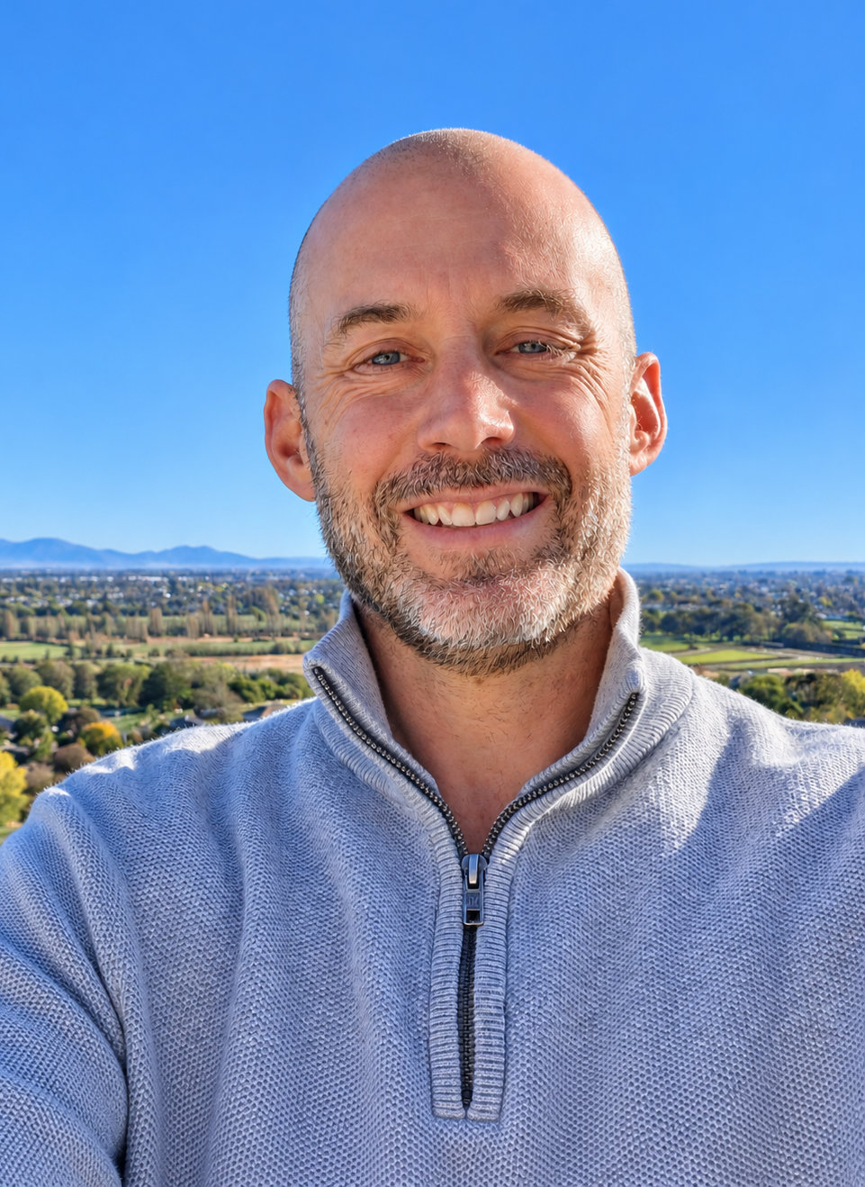 Phil Hopkins, owner of Hit IT, smiling outdoors